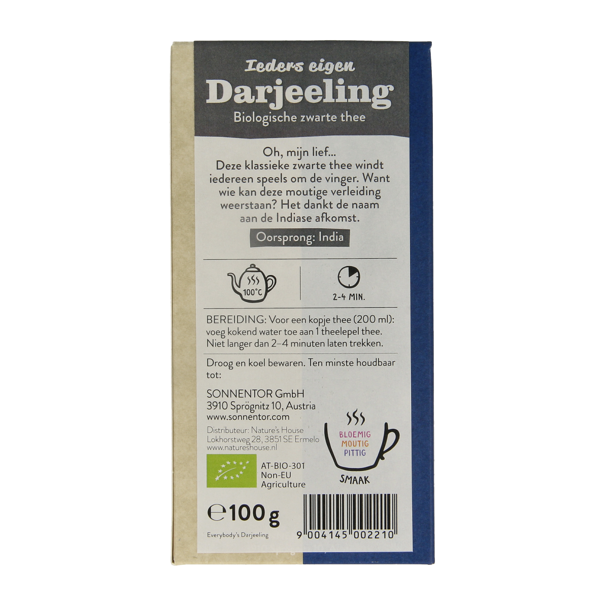 Organic Sonnentor Darjeeling black loose leaf tea in a 100g package, showcasing dried tea leaves in a natural setting.