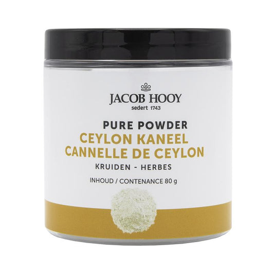 Jar of Jacob Hooy Ceylon cinnamon powder, 80g, in a clear glass container with a label, used as a spice and cooking ingredient.