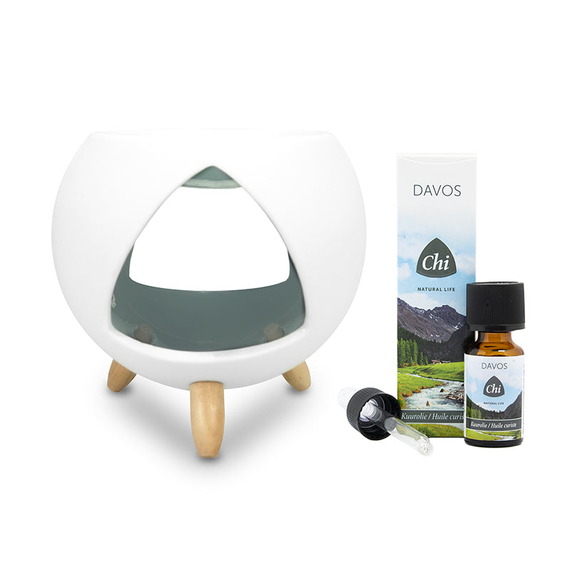 Chi Cozy aromabrander with Davos essential oil bottle, showcasing a relaxing diffuser and a 1.00-liter bottle of aromatic oil.