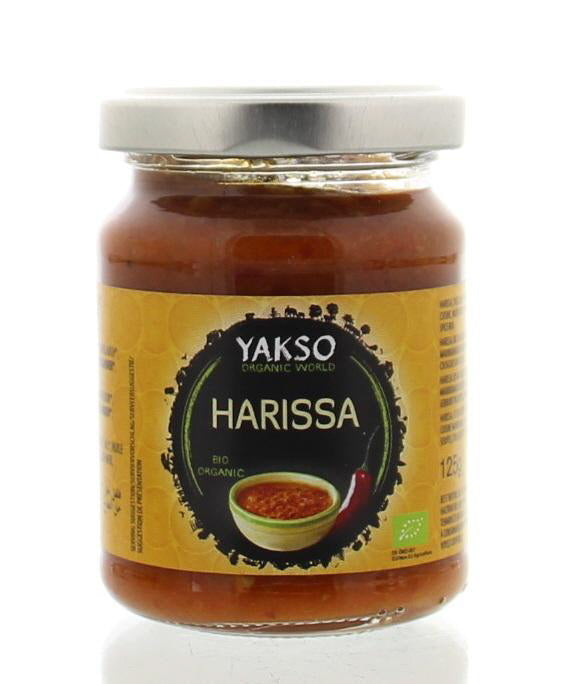 Organic Yakso Harissa spice blend in 125g package, featuring a vibrant red chili and spice mixture for flavorful dishes.
