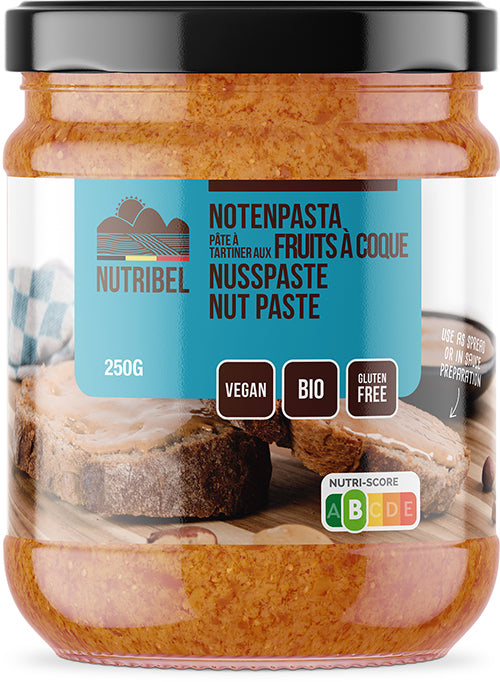 Nutribel organic mixed nut paste spread on bread, 250g jar, creamy texture and nutty flavor, ideal for breakfast or snacks.