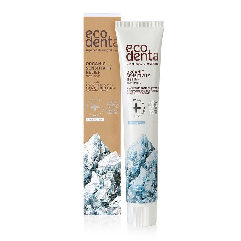 Ecodenta organic toothpaste for sensitive teeth, 75ml tube, natural ingredients, close-up of the toothpaste tube showing branding and packaging