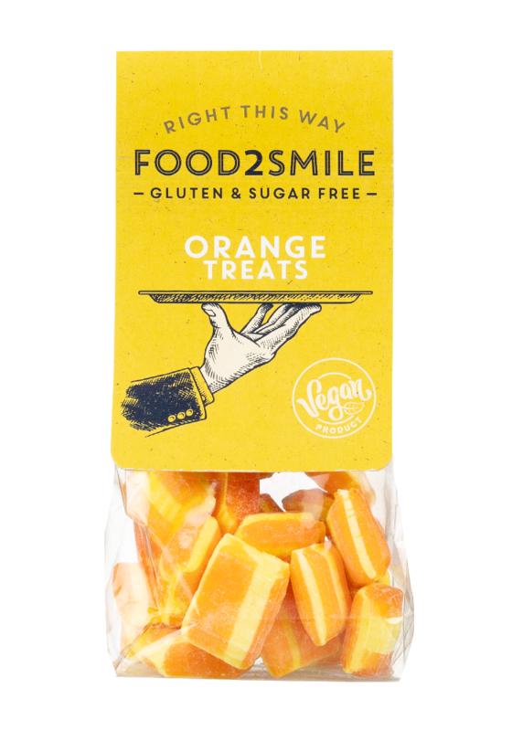 Food2Smile orange gluten-free, lactose-free candy treats in a 90g package, colorful and appealing snoepgoed on a white background.