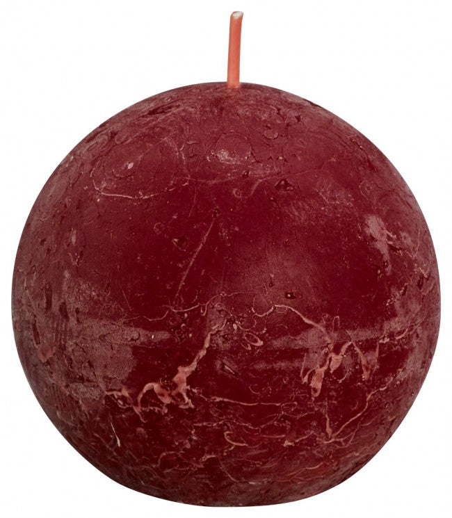 Bolsius Rustiek bolkaars Shine 76 velvet red candle, showing the textured surface and warm red color.
