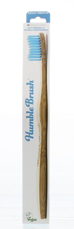 Medium bamboo toothbrush by The Humble Co with blue bristles, eco-friendly oral care product for sustainable brushing.