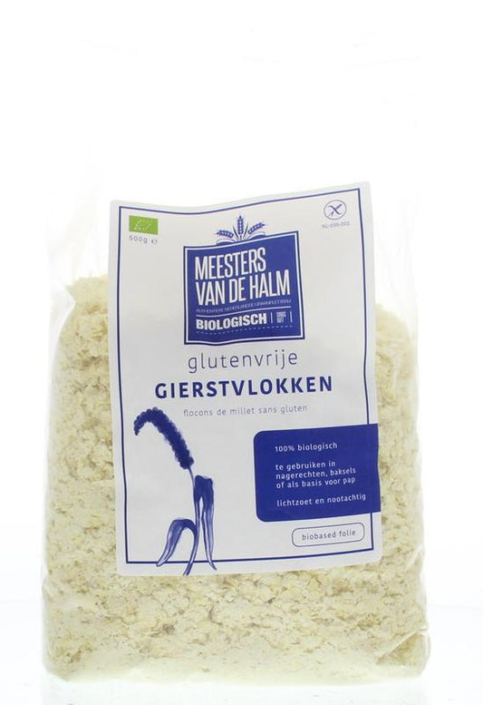 Raw De Halm Gierstvlokken bio in a 500g package, showing golden millet flakes in a clear view.