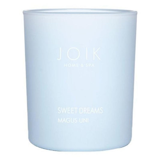 Joik Organics vegan scented candle with sweet dreams fragrance, 150g, showcasing a cozy candle in a natural setting.