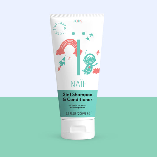 Naif 2-in-1 kids shampoo and conditioner bottle, 200ml, for gentle hair cleansing and conditioning in a colorful packaging