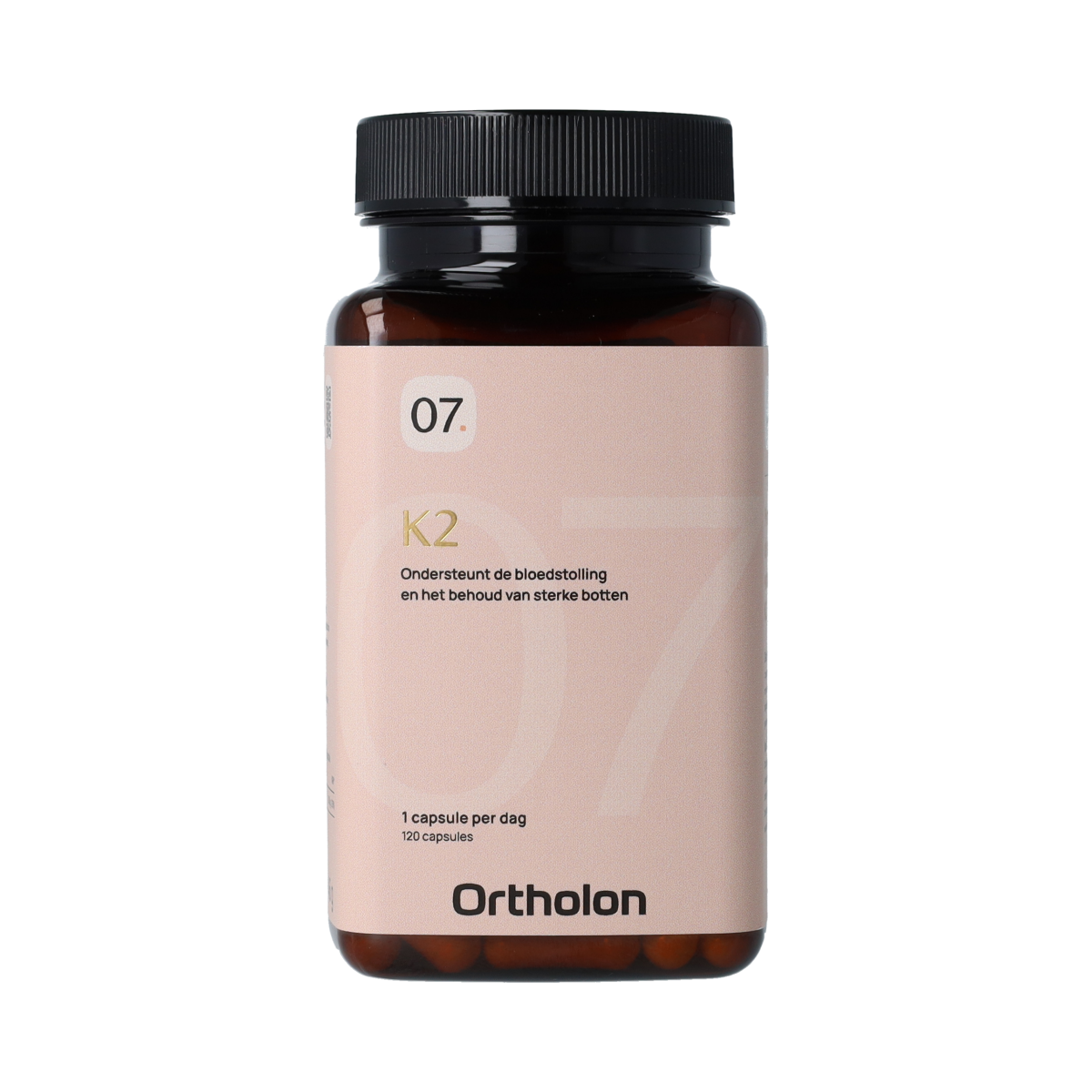 Ortholon Vitamin K2 capsules in a bottle, supplement for bone and cardiovascular health, shown in a natural setting