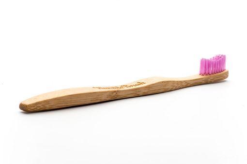 Pink bamboo toothbrush by The Humble Co with soft bristles for adults, displayed with one toothbrush in the image.