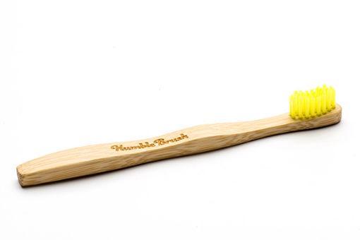 The Humble Co bamboo kids toothbrush with soft bristles in yellow, featuring a colorful handle and eco-friendly design.