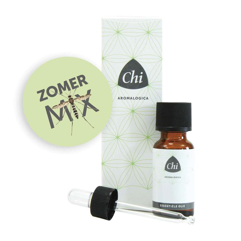 Bottle of Chi Zomermix essential oil in a clear glass container with a white label, surrounded by fresh herbs and flowers.