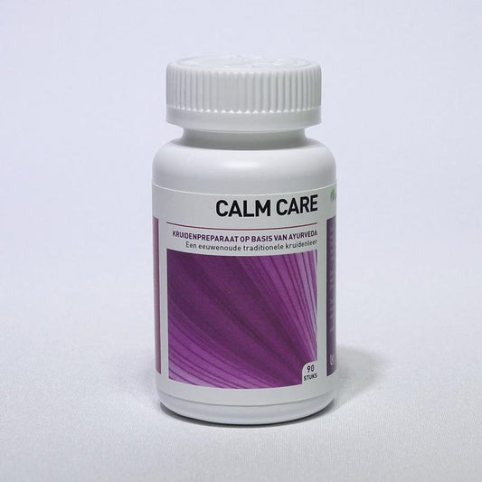 Ayurveda Health Calmcare herbal tablets in a white container with a label, designed for natural health and wellness.