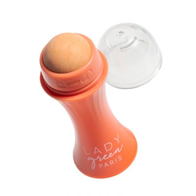 Lady Green green volcanic stone face roller for skincare, shown in a close-up on a white background.