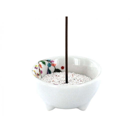 Volatile flora incense burner for burning incense sticks, featuring a decorative floral design on a ceramic holder.