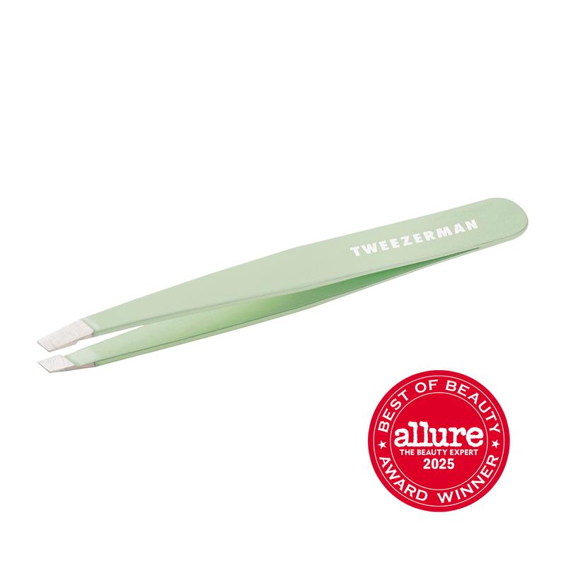 Tweezerman Slant Tweezer in pistachio green, made of stainless steel, with a precise slanted tip for eyebrow grooming.