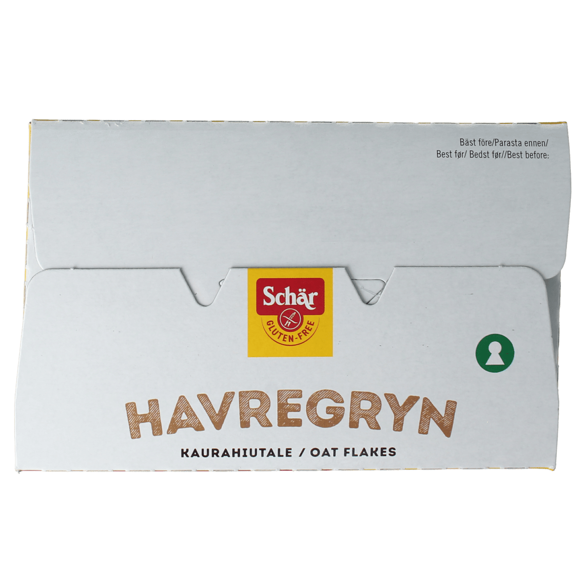 Schar glutenvrije havervlokken ontbijtgranen in een witte kom, klaar om te serveren, met een glazen schaal en lepel.