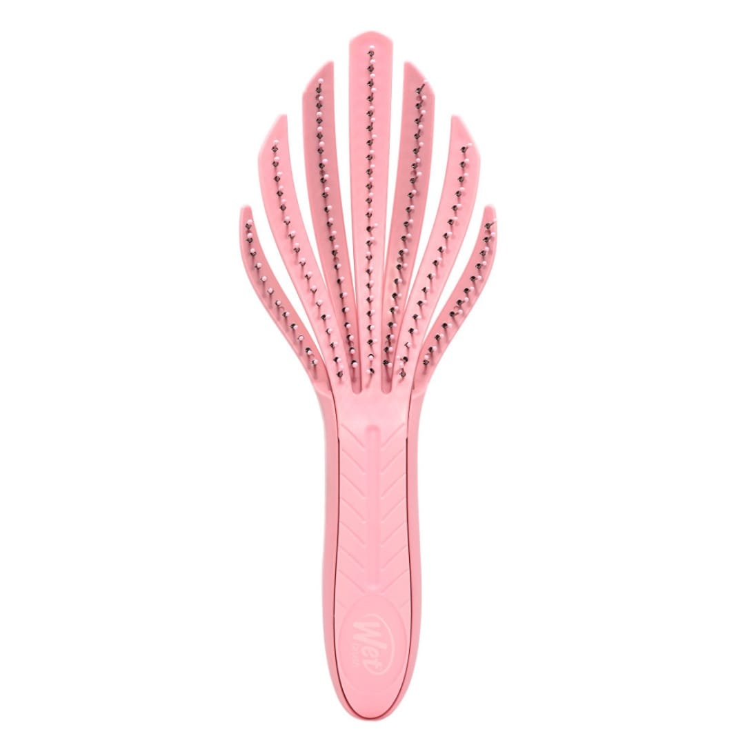 Wet Brush Go Green curl detangler sponge and brush set in pink, designed for easy detangling of curly hair.